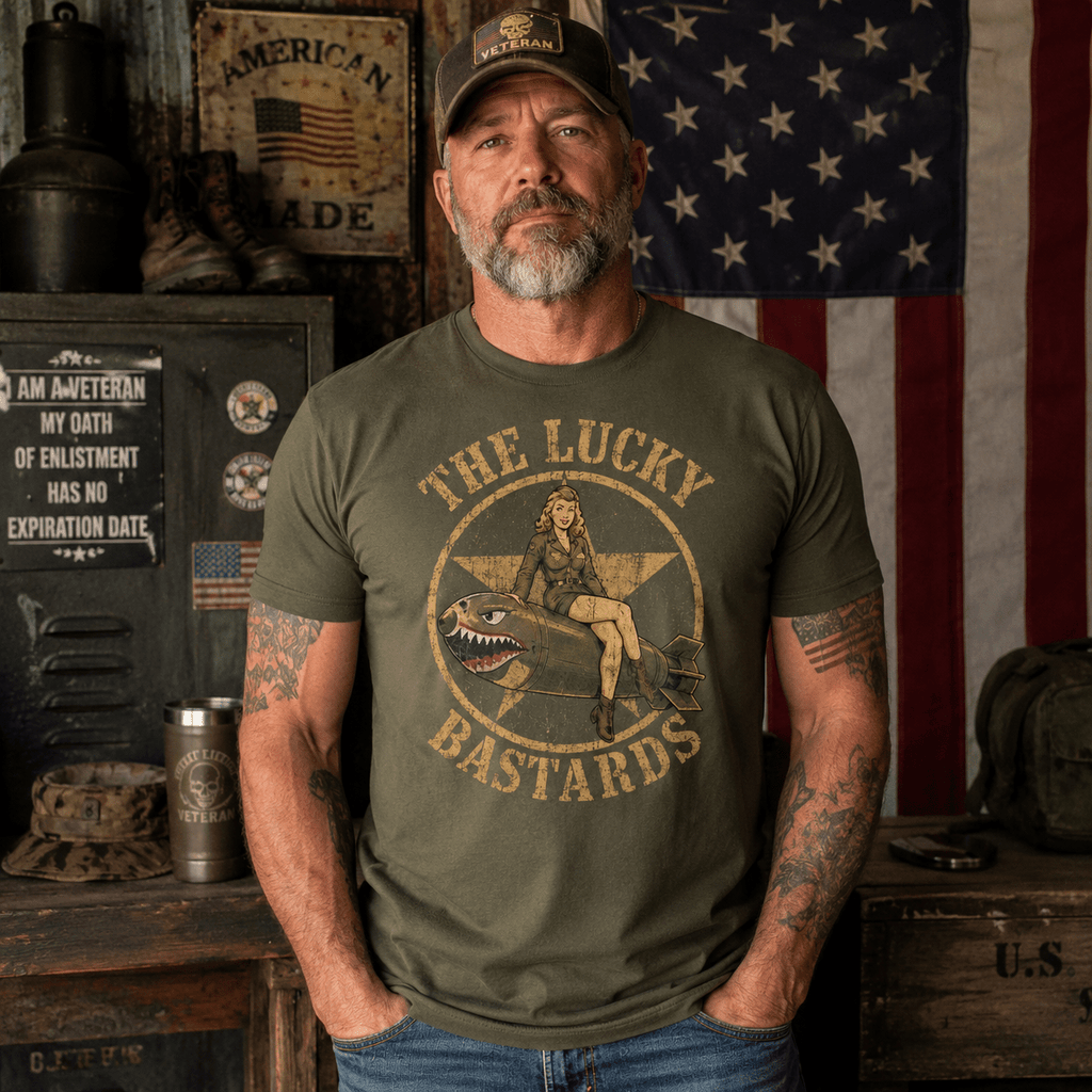 Man wearing the military-green Veteran Shirts Lucky Bomber Squadron tee with pin-up and shark-mouth bomb artwork